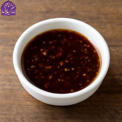 sos-teriyaki-with-sesame-seeds-in-a-white-bowl-on-wooden-table